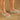 person wearing mint Archies flip flops on a wooden floor