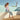 Woman sitting by a pool wearing tan Archies flip flops