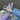 Person wearing lilac Archies flip flops, light blue jeans and a matching lilac knitted jumper